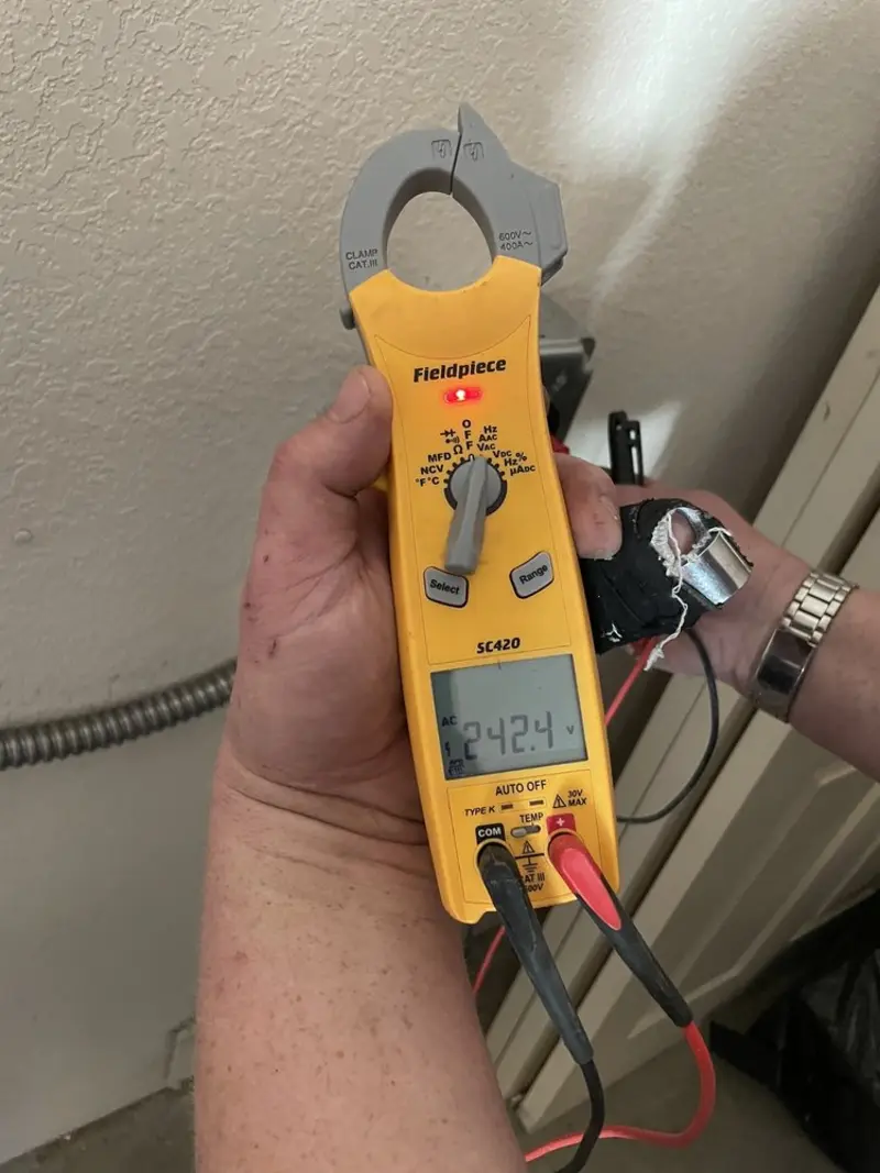 Voltage testing with clamp meter during Whole House Surge Protector in Yorktown